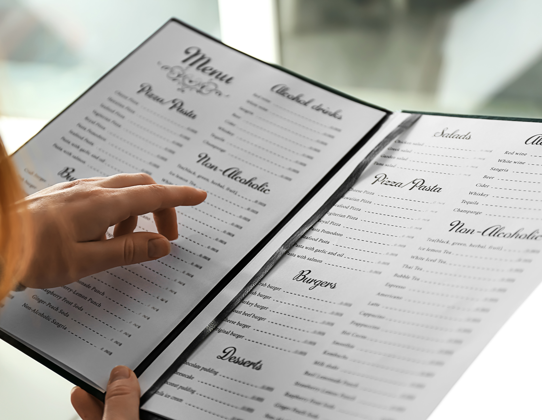 Close up image of a person reading a menu
